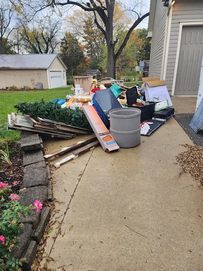 Dumpster being loaded with debris for Roofing Dumpster Rental in Sherburne